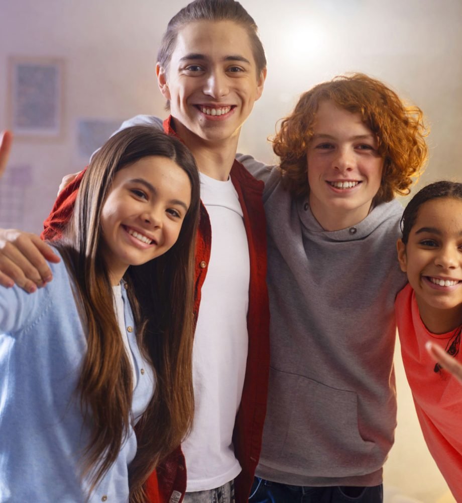 group-teenage-friends-posing-together-home-party
