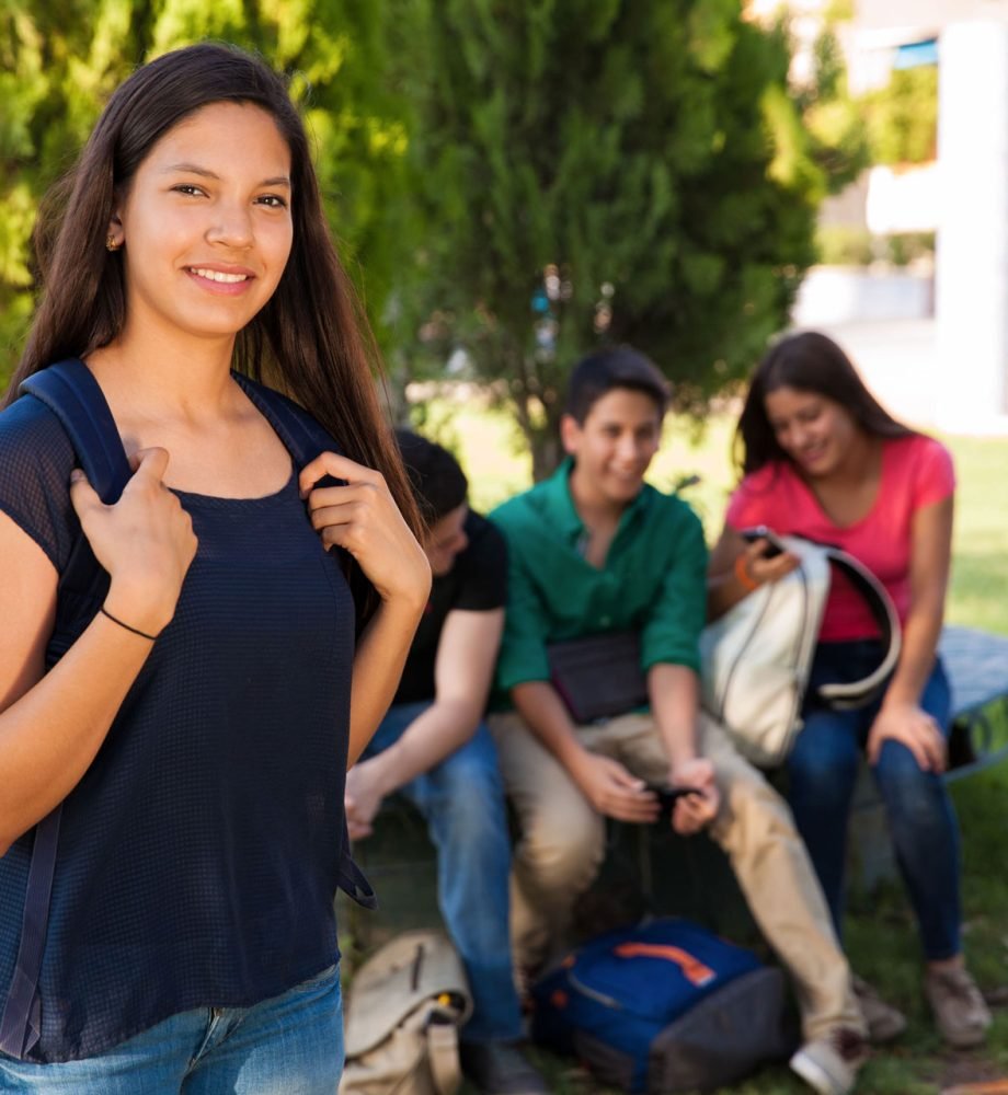 portrait-pretty-latin-student-hanging-out-with-some-friends-school